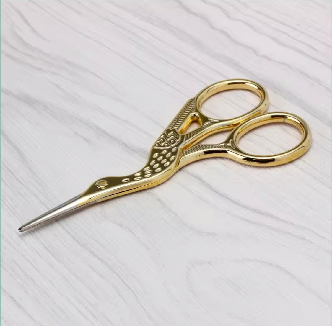 stork shaped scissors gold